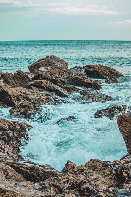 Free Dramatic view of a rocky shoreline with waves crashing in São Paulo, Brazil. Stock Photo
