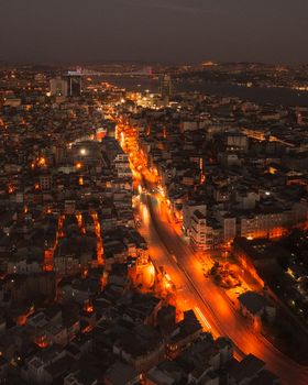 Stunning aerial night view of Beyoğlu, Istanbul showcasing illuminated streets and city lights.
