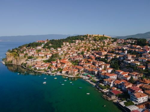 Free Stunning aerial shot of Ohrid's historic waterfront with clear waters and traditional architecture. Stock Photo