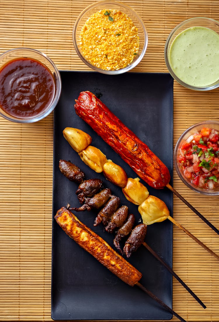 Overhead Shot Of Skewers And Dipping Sauces 