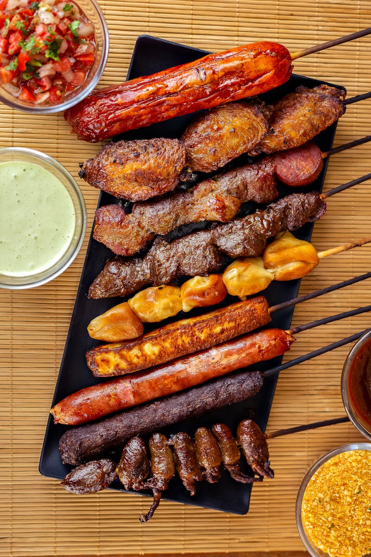 Overhead Shot Of Skewers And Dipping Sauces