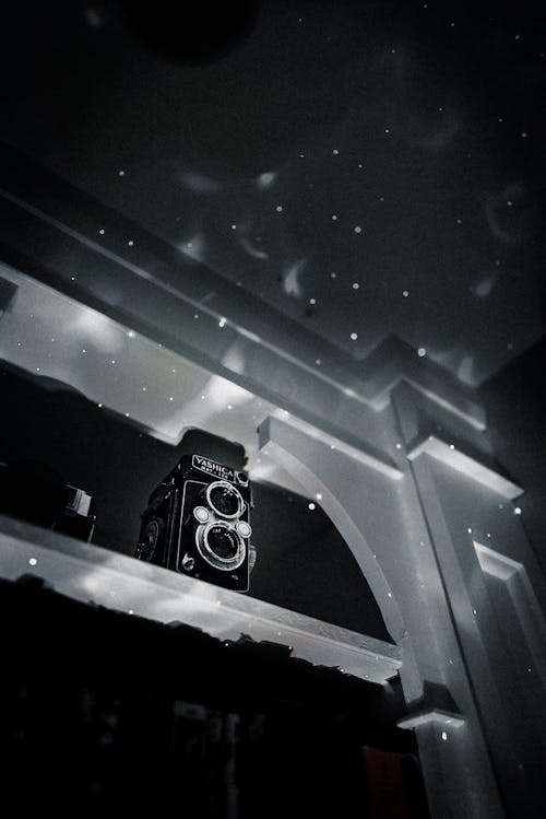 Foto profissional grátis de 24mm, câmera antiga, clarões de luz