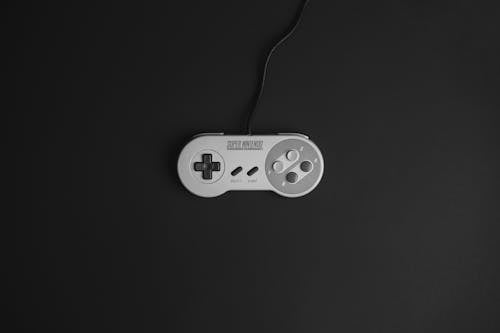 Grayscale Photo of a Super Nintendo Game Controller