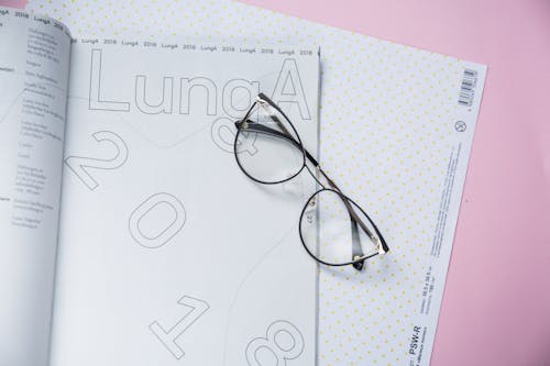 Framed Eyeglasses on Top of a Book