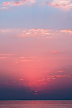 Breathtaking view of a vibrant ocean sunset with a dramatic sky, perfect for nature enthusiasts.