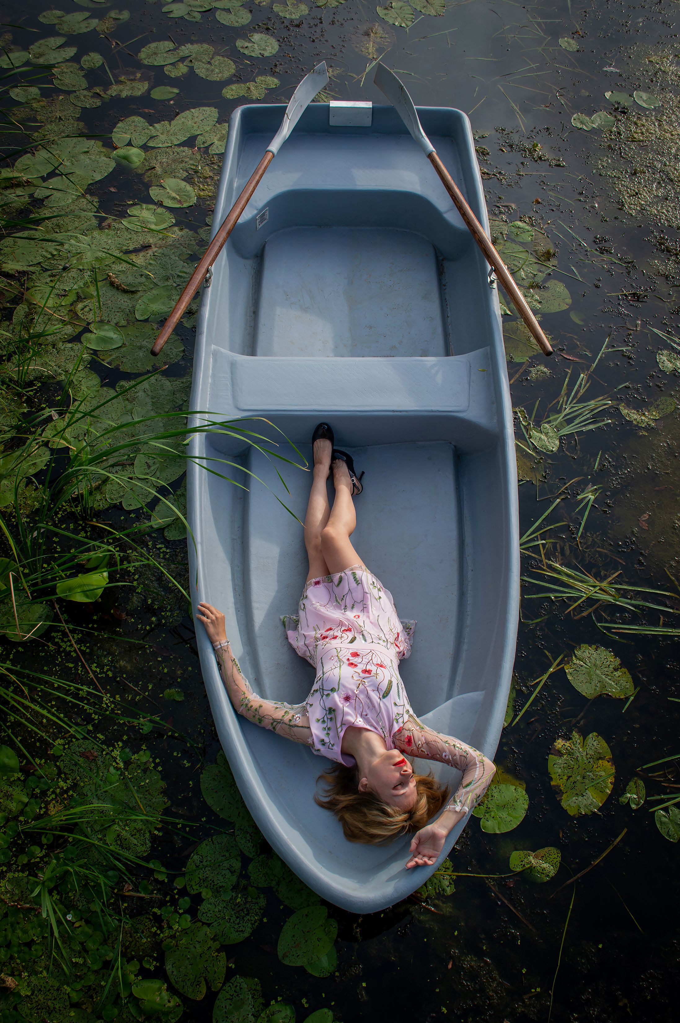 Woman in Floral Dress Lying on the Boat · Free Stock Photo