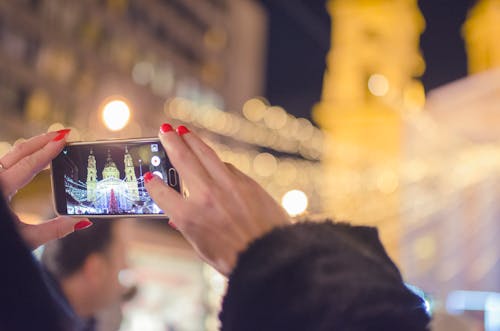 Person Taking Photo of a Building