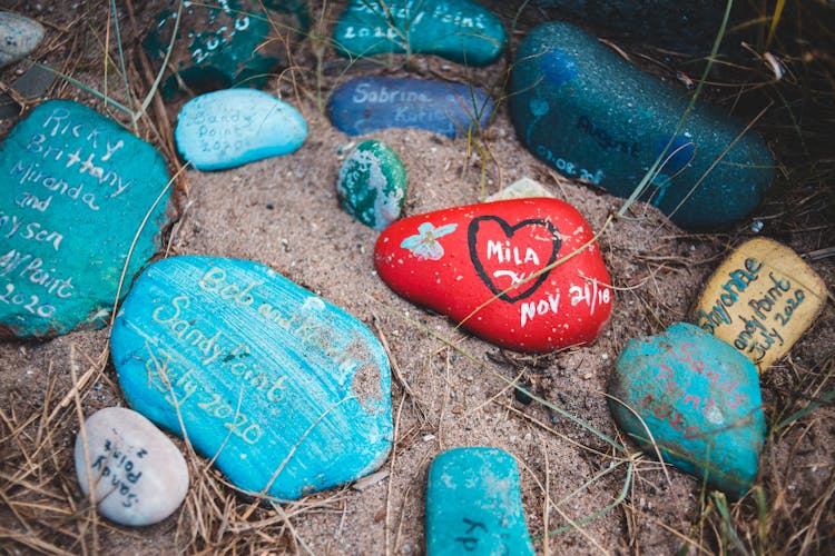 Painted Pebbles On Sand