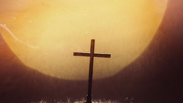 A striking silhouette of a wooden cross against a vivid sunset, evoking spirituality and peace.
