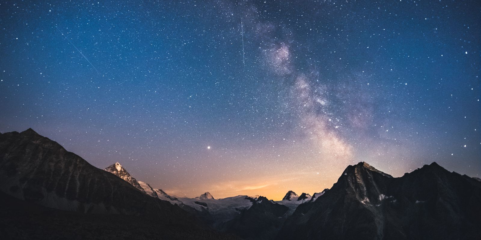Milky Way night sky over mountains