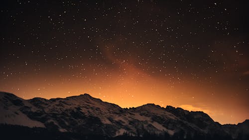 Snow Covered Mountains Under Starry Sky