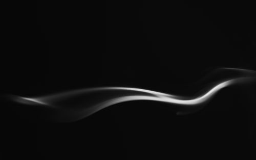Free A captivating abstract image of smooth smoke waves in black and white, displaying gentle curves and texture. Stock Photo