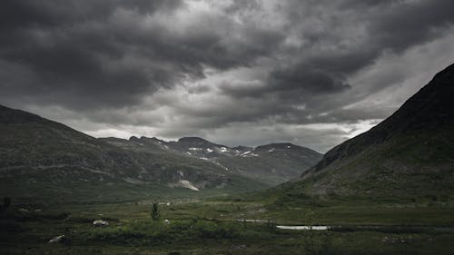 Green Mountains under Gloomy Sky