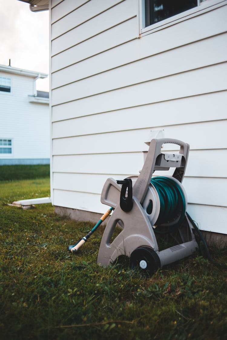 Rolled Water Hose On Grass