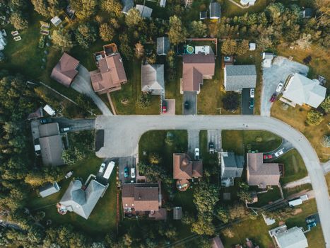 A top-down view of a suburban neighborhood showing houses, streets, and greenery.