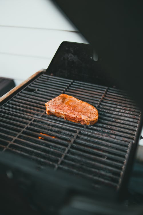 A Steak being Grilled