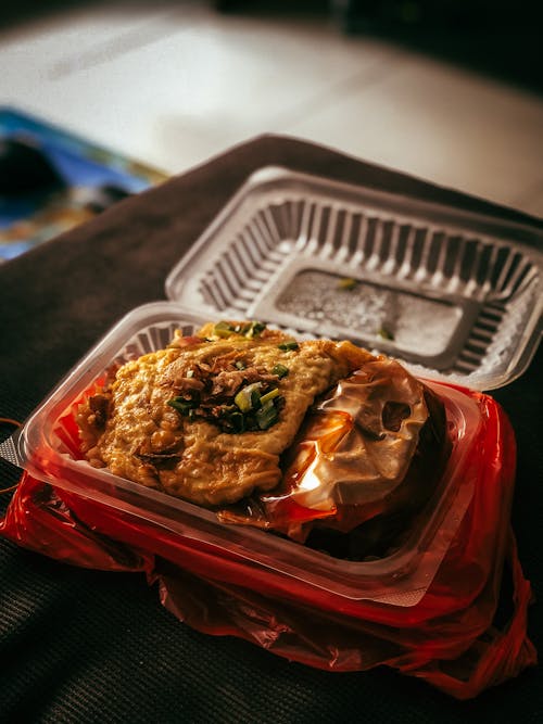 Free Cooked Food in a Plastic Container Stock Photo