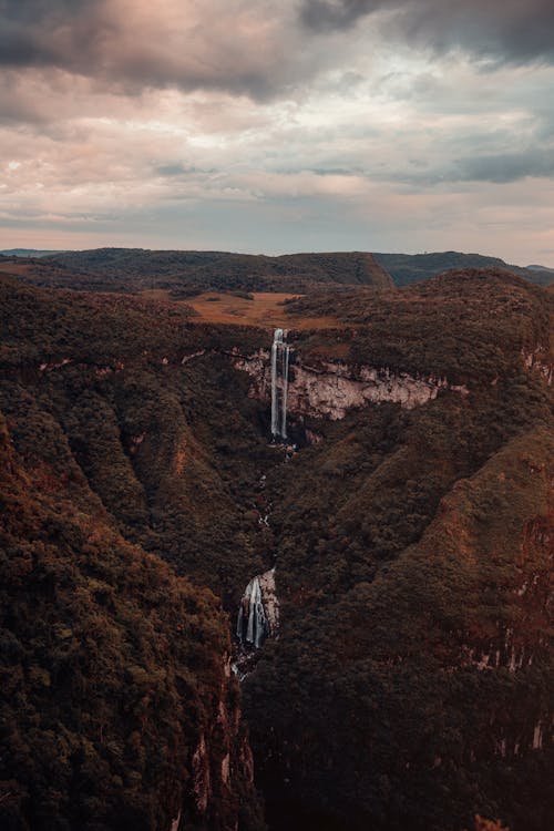 Aerial Footage of Mountains under Cloudy Sky 