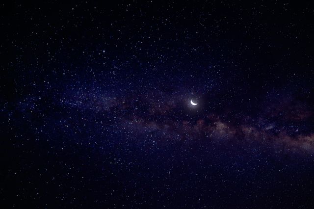 Crescent moon over a star-filled night sky, photo by Min An on Pexels