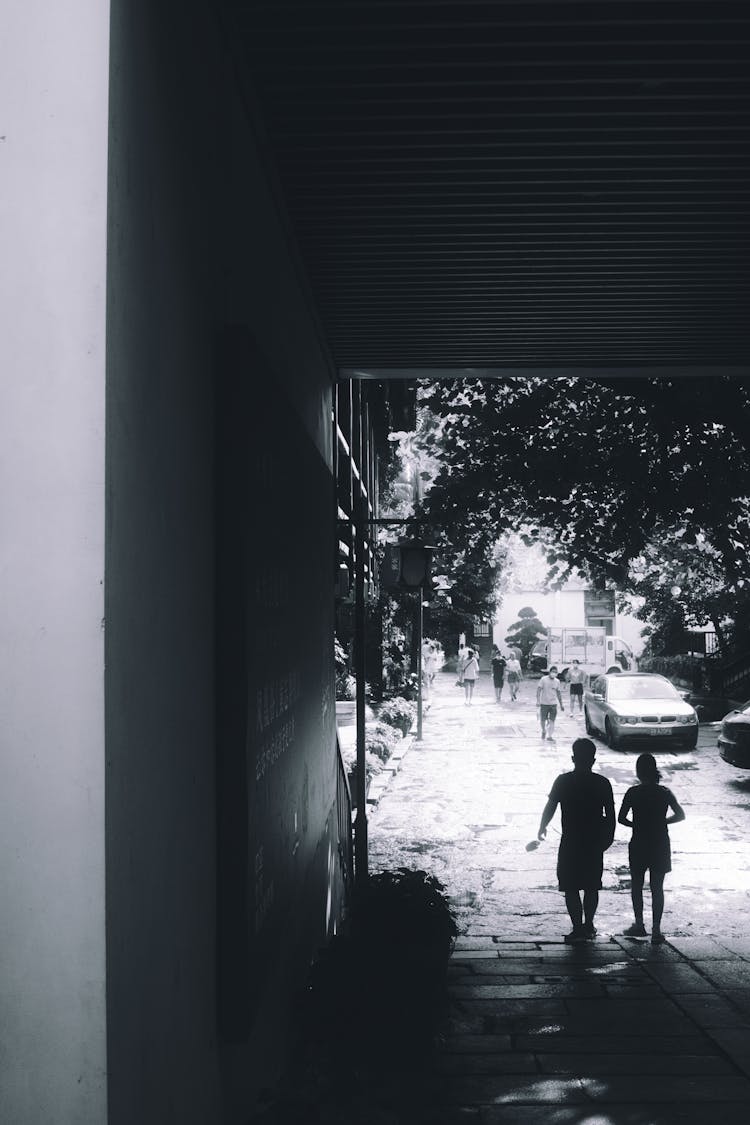 
A Silhouette Of A Couple Walking Together