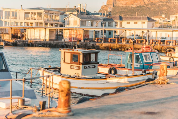 Docked Fishing Boats By The Pier 