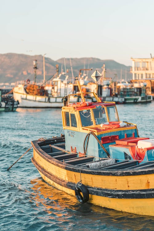 Free Fishing Boat Docked During Sunrise Stock Photo