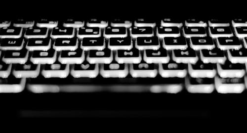 Free Black and White Mechanical Keyboard With White Led Lights Stock Photo