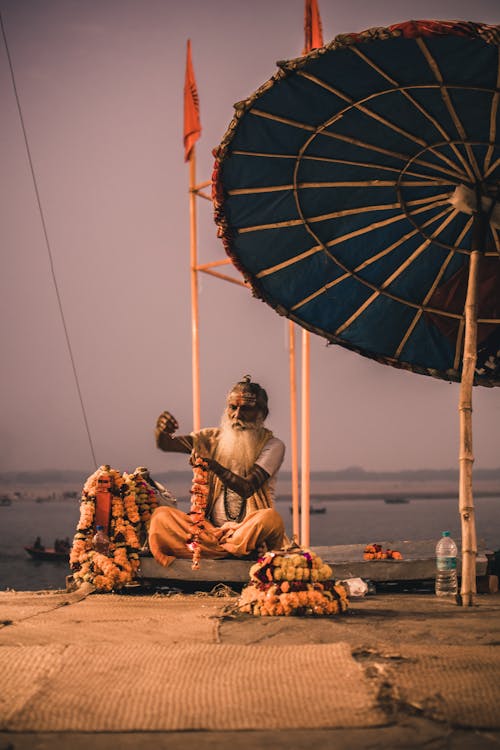 Man with Beard Sitting and Performing Ritual