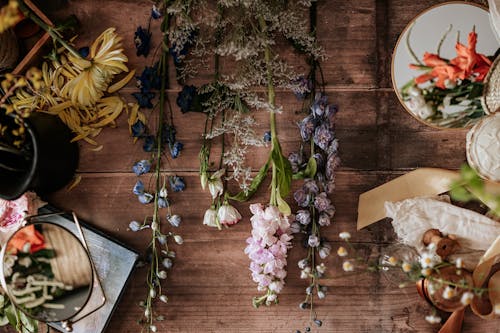 Overhead Shot of Flowers on Wooden Surface
