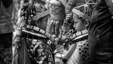 Grayscale Photo of Girls in Costumes with Headdresses