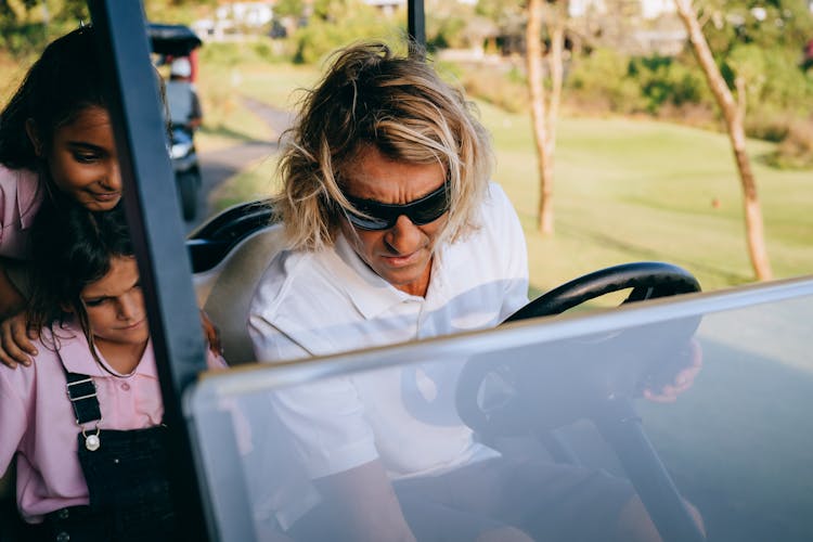 Man In White Polo Shirt Wearing Sunglasses 