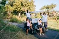 3 Women and 2 Men Riding Golf Cart