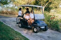 2 Women Riding on Golf Cart
