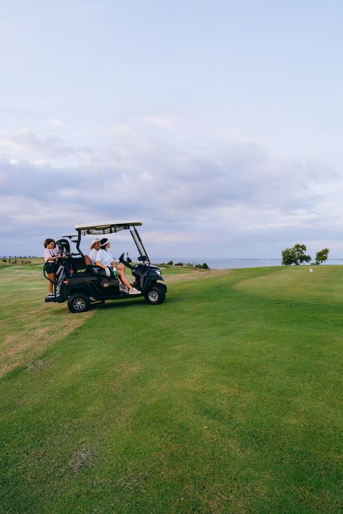 Golf Course Rides A Family Riding a Golf Cart · Free Stock Photo