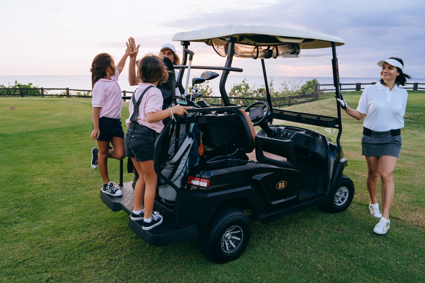 Woman golfer swinging