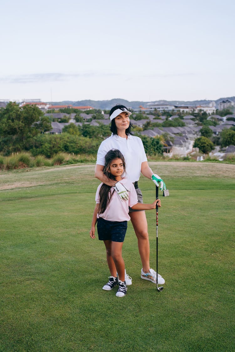 
A Mother And Her Daughter On A Golf Course