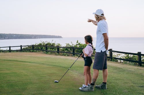 Father and Daughter Playing Golf