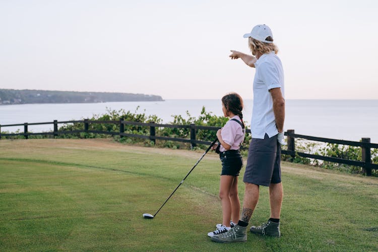 Father And Daughter Playing Golf