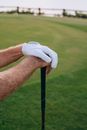 Person in White Nike Shoes Holding Black and White Stick