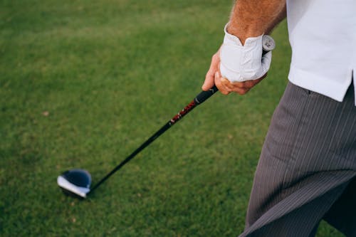Free A Golfer Holding a Golf Club Driver Stock Photo