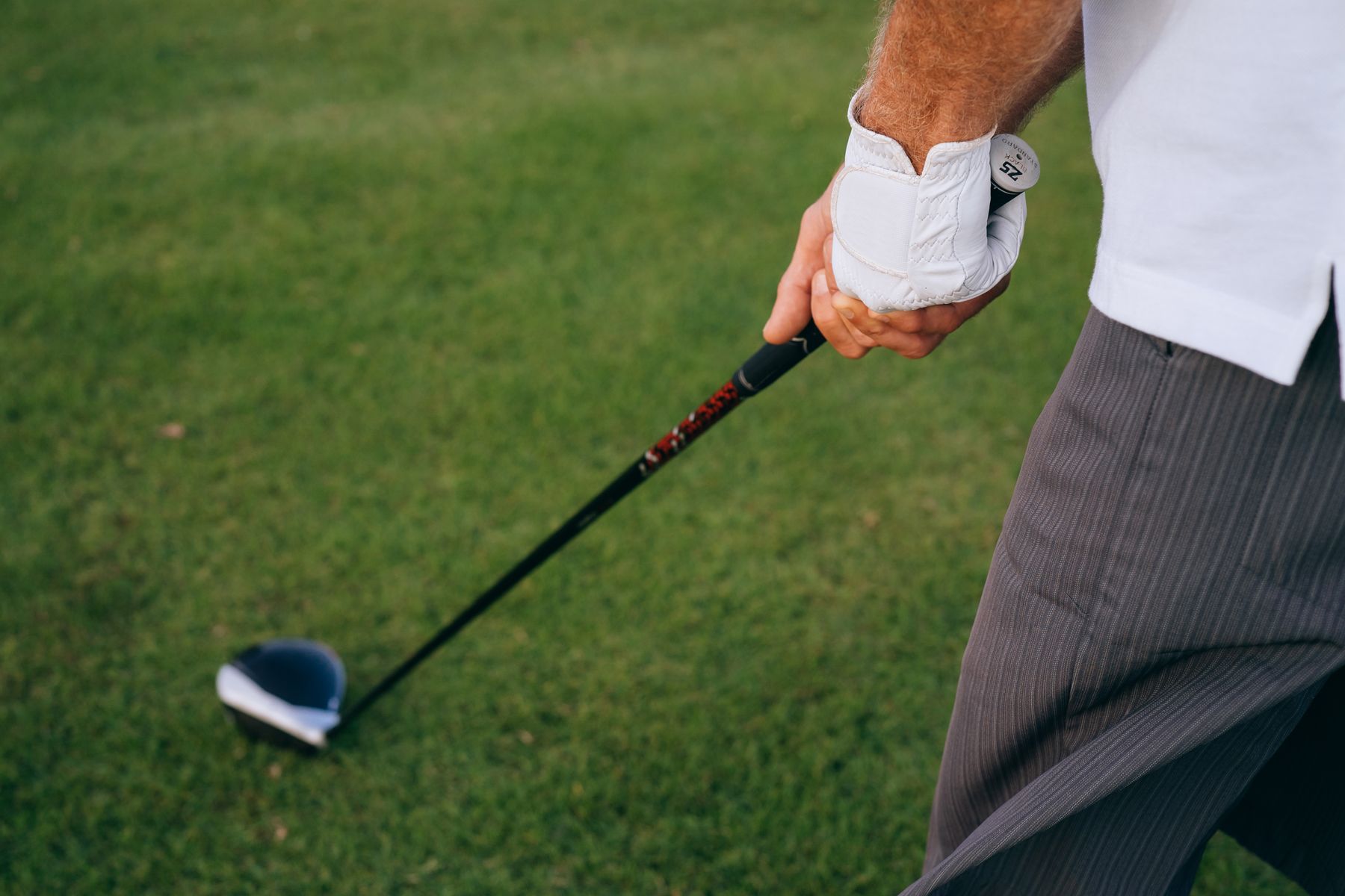 Golfer mid-swing