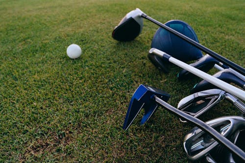 
A Close-Up Shot of Golf Clubs and a Golf Ball