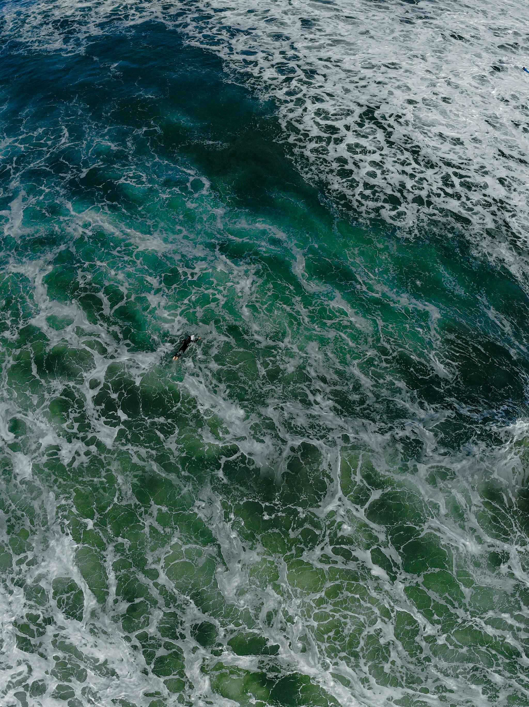 Top View Photo of Person Surfing · Free Stock Photo