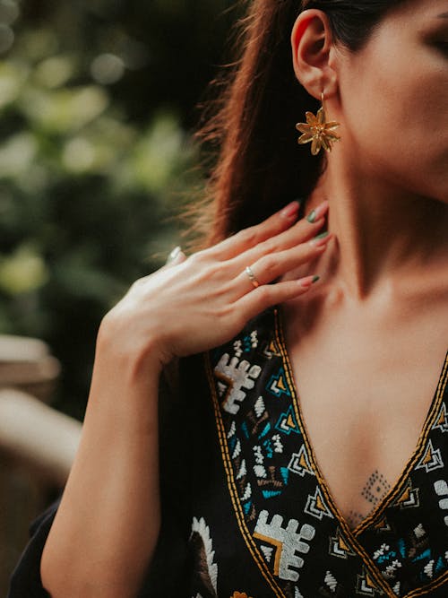 Free 
A Woman with Manicured Nails Wearing an Earring Stock Photo
