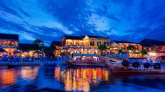 Village Near Body of Water Photo during Nighttime