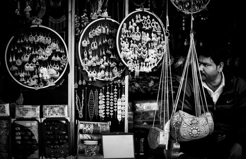 Free Elegantly arranged jewelry and accessories displayed at a street market in black and white. Stock Photo