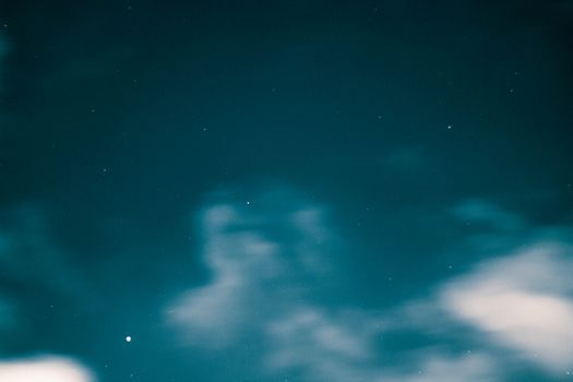 A captivating night sky with stars and clouds over Karachi, creating a serene atmosphere.