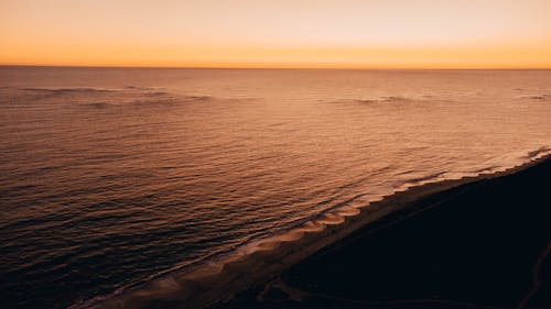 Drone Shot of a Sunset at a Beach