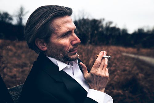 Free Photo of Man Holding a Cigarette Stock Photo