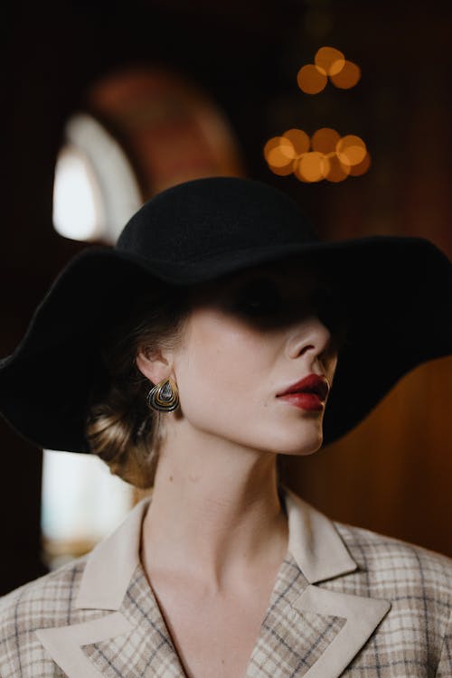 Selective Focus of a Beautiful Woman Wearing Her Black Hat